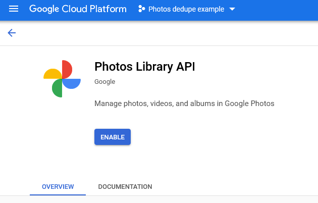 The Photos Library API shown in the API library, with a blue “Enable” button